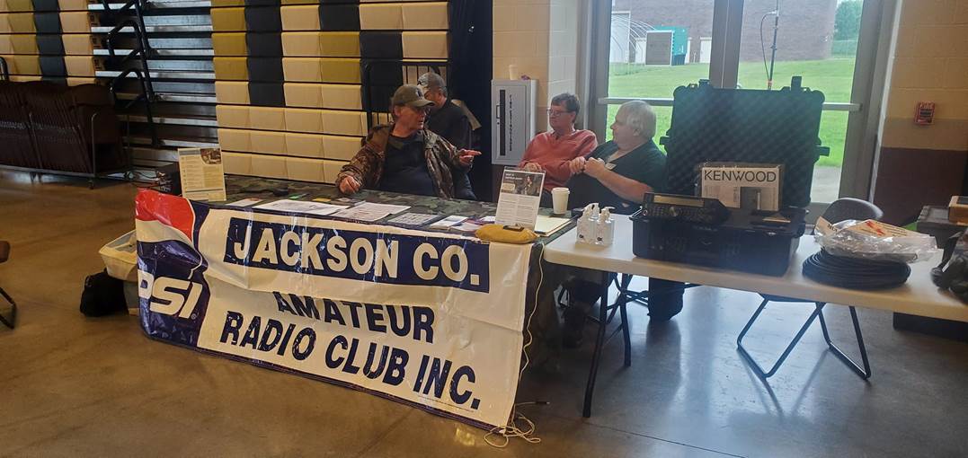 A group of people sitting at a table with food on it
Description automatically generated with low confidence